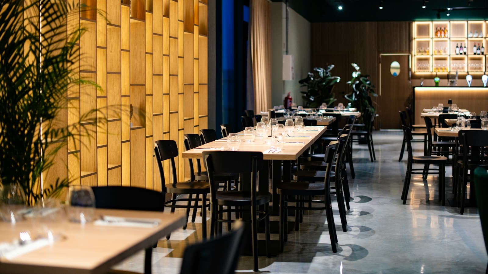 Bright restaurant dining room with laid tables